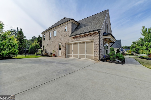 view of side of home featuring a garage