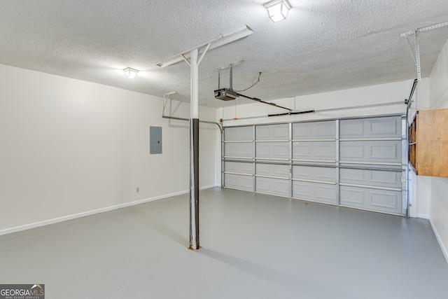 garage featuring a garage door opener and electric panel