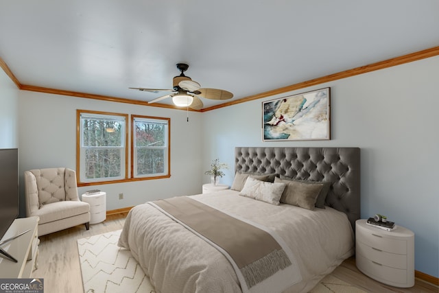 bedroom featuring ceiling fan, crown molding, and light hardwood / wood-style flooring