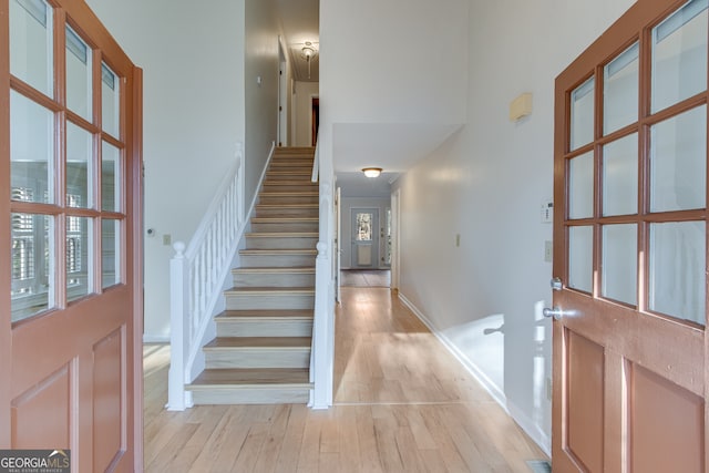 entryway with a healthy amount of sunlight and light hardwood / wood-style floors