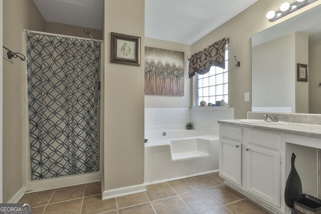 bathroom with tile patterned floors, vanity, and independent shower and bath