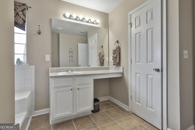 bathroom featuring vanity and a bathtub