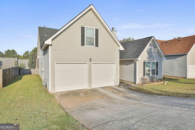 view of front facade featuring a garage and a front lawn