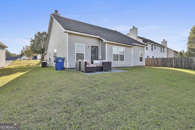 rear view of house featuring a lawn, central AC unit, and an outdoor hangout area