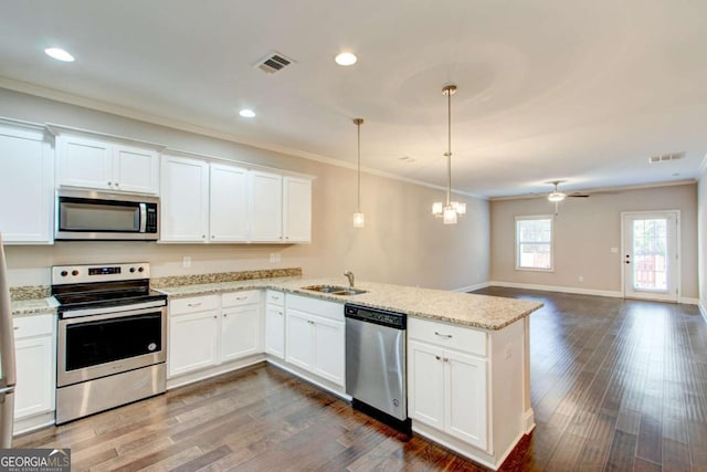 3770 Shades Valley Ln, Gainesville, GA 30501 - kitchen with white cabinets, decorative light fixtures, ceiling fan with notable chandelier, and appliances with stainless steel finishes