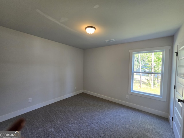 210 Hummingbird Ln Unit 08, Statham, GA 30666 - empty room featuring baseboards and dark carpet
