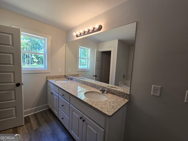 210 Hummingbird Ln Unit 08, Statham, GA 30666 - full bath featuring double vanity and wood finished floors