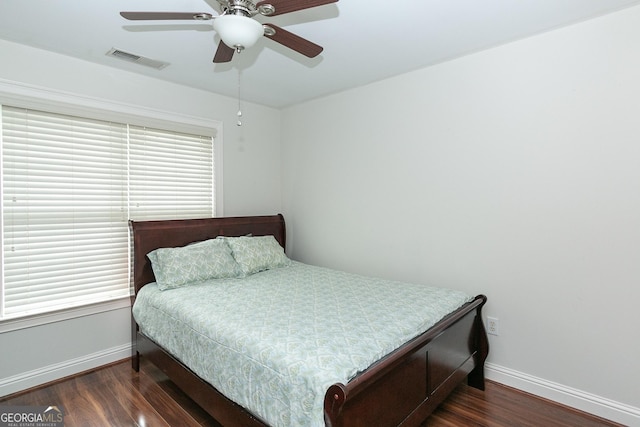 bedroom featuring ceiling fan and dark hardwood / wood-style flooring