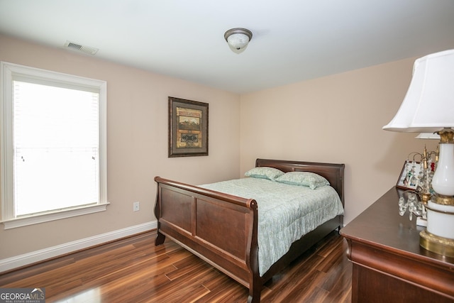 bedroom featuring dark wood-type flooring