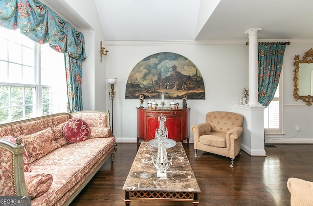 living area with lofted ceiling, dark hardwood / wood-style flooring, ornate columns, and crown molding