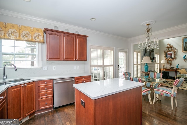 kitchen with dishwasher, dark wood-type flooring, sink, hanging light fixtures, and a kitchen island