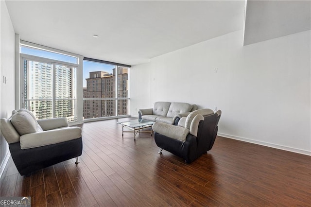 living room featuring expansive windows and dark hardwood / wood-style flooring