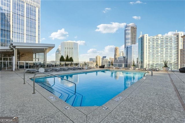 view of swimming pool with a patio area