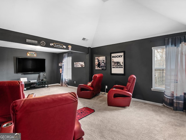 living room with carpet floors and vaulted ceiling