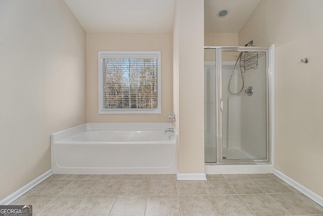 bathroom featuring separate shower and tub