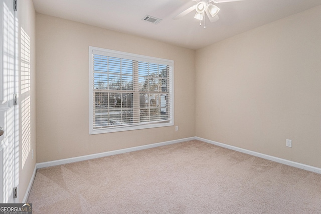 carpeted empty room with ceiling fan