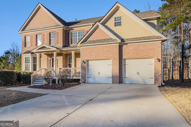 view of front of house featuring covered porch and a garage