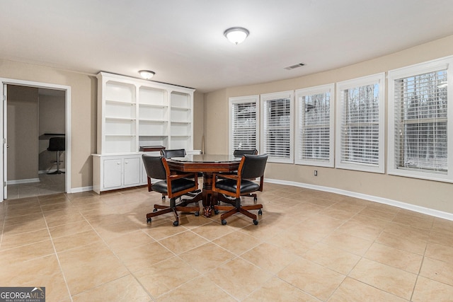 dining area featuring light tile patterned floors