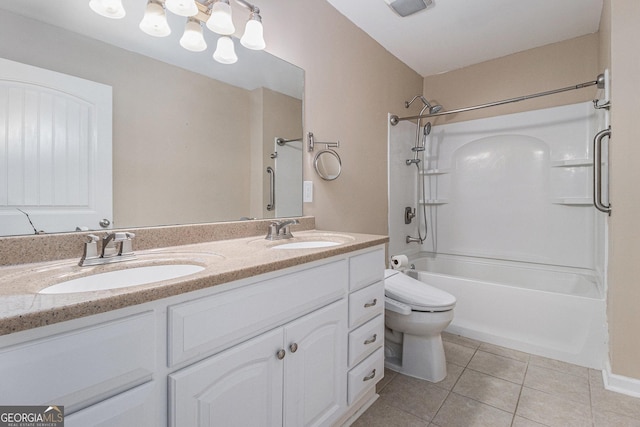 full bathroom with tile patterned flooring, vanity,  shower combination, and toilet