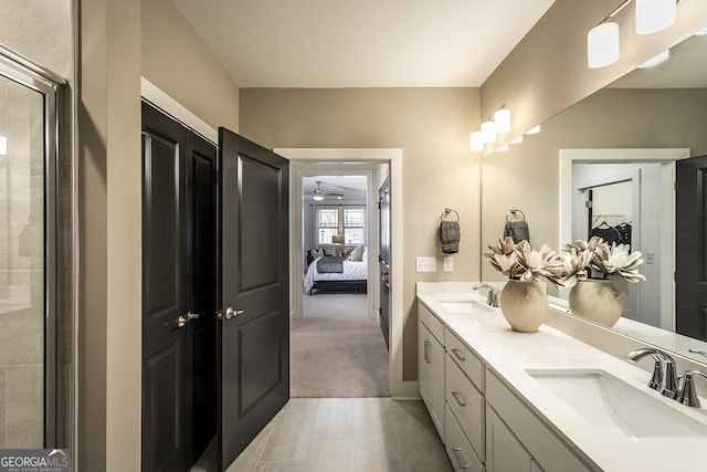 bathroom featuring ceiling fan and vanity