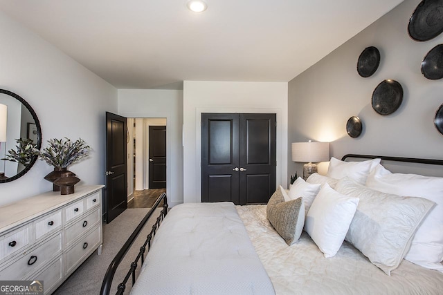 carpeted bedroom featuring a closet