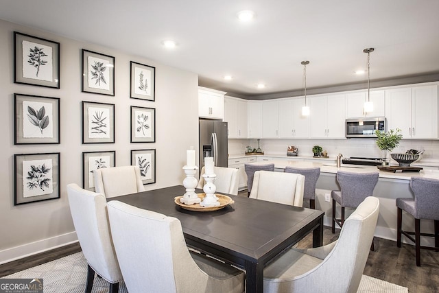 dining area featuring dark hardwood / wood-style flooring