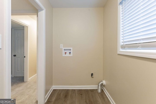 washroom featuring electric dryer hookup, washer hookup, and wood-type flooring