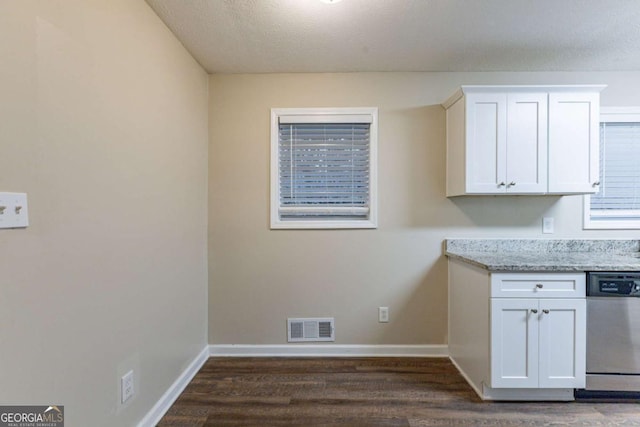 washroom featuring a textured ceiling and dark wood-type flooring