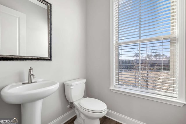 bathroom featuring toilet and sink