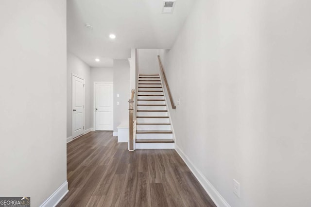 stairs with hardwood / wood-style flooring