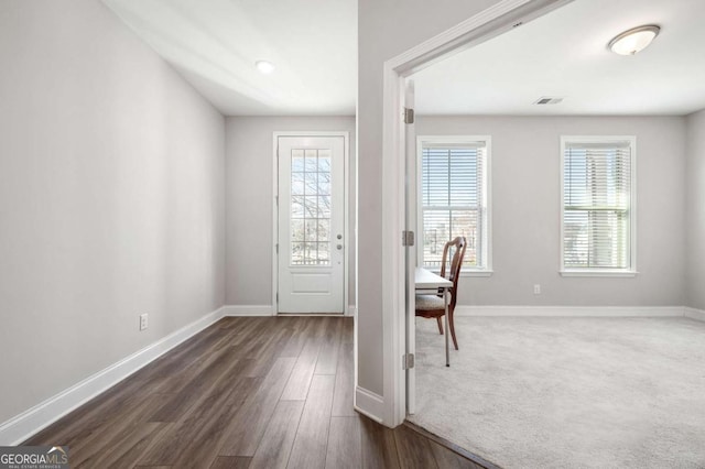 doorway to outside with dark hardwood / wood-style flooring