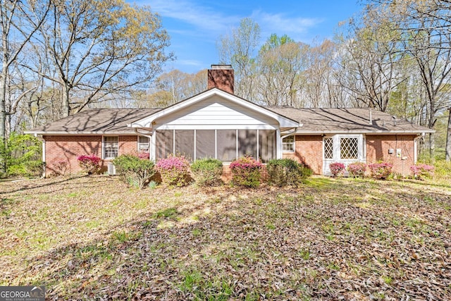 back of house with a sunroom