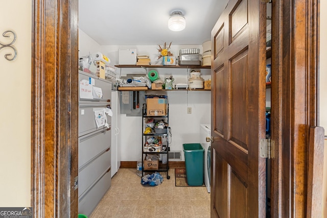 storage room with independent washer and dryer