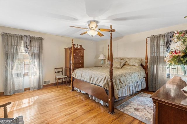 bedroom with light wood-type flooring and ceiling fan