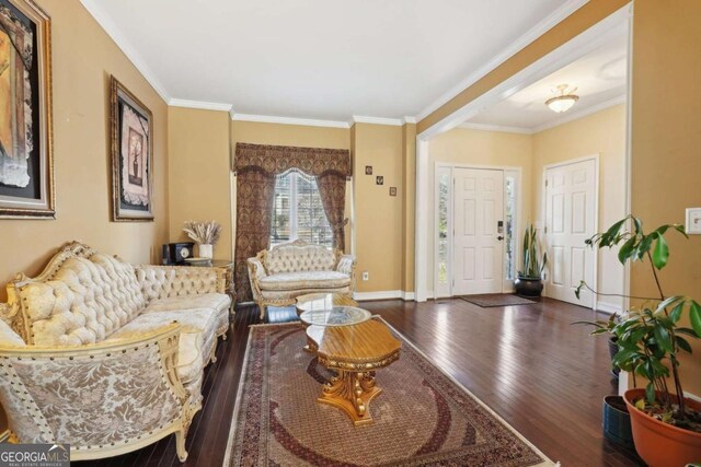 living room featuring dark hardwood / wood-style floors and ornamental molding