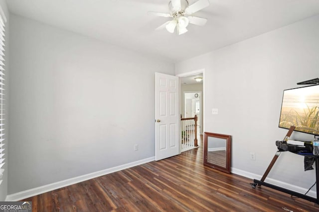 interior space featuring ceiling fan and dark hardwood / wood-style flooring