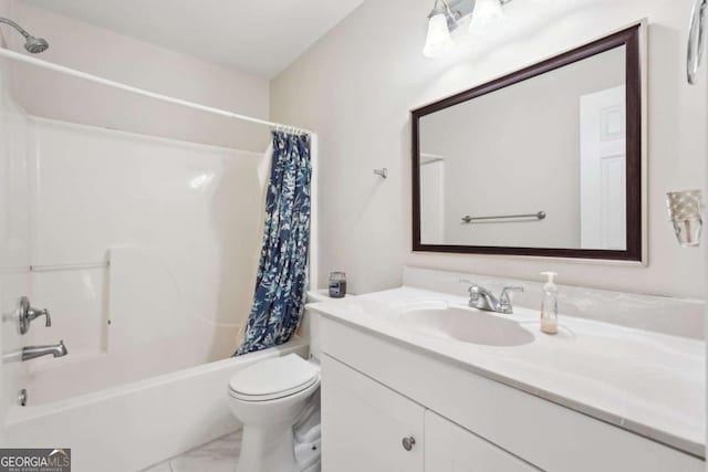 full bathroom featuring shower / bath combo, vanity, and toilet