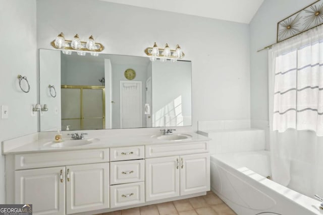 bathroom with tile patterned flooring, vanity, independent shower and bath, and vaulted ceiling