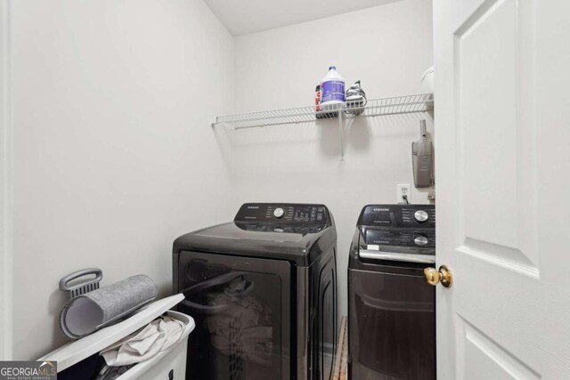 laundry room featuring washing machine and dryer