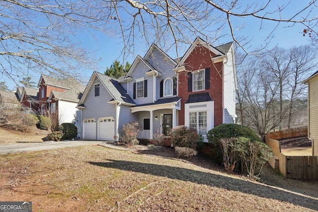 view of property featuring a porch and a garage