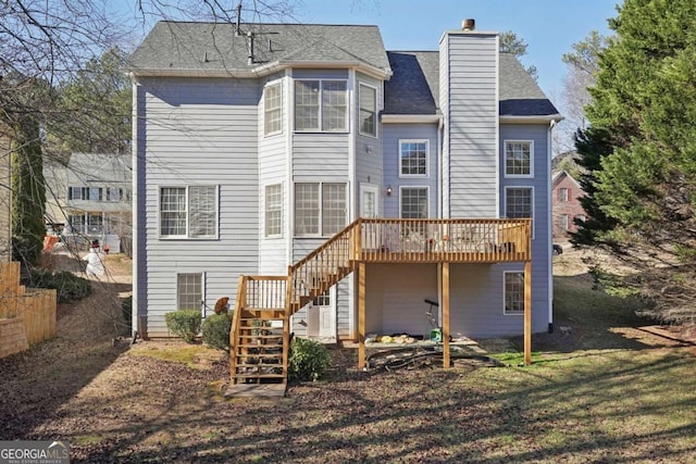 back of property with a wooden deck