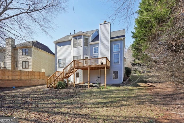 back of house featuring a wooden deck