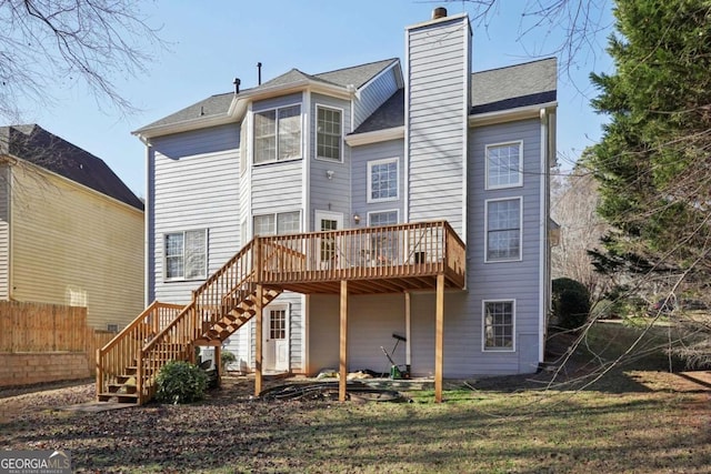 back of property with a wooden deck