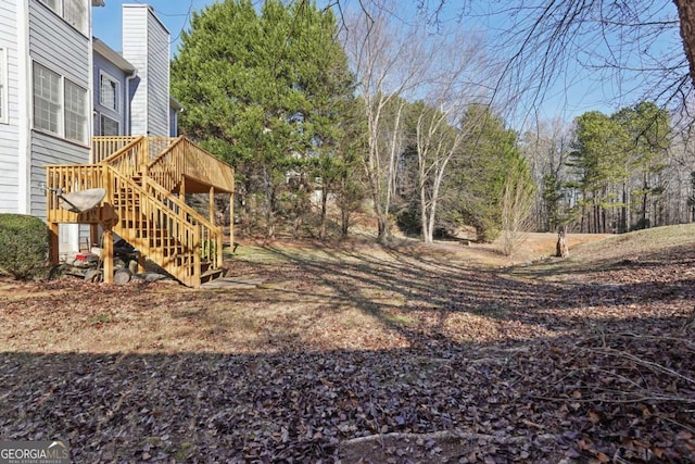 view of yard featuring a wooden deck