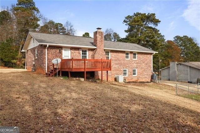 back of house with a wooden deck