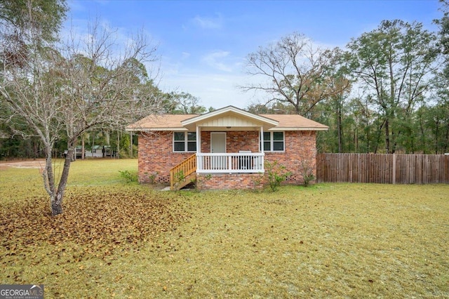 ranch-style house with a porch and a front yard