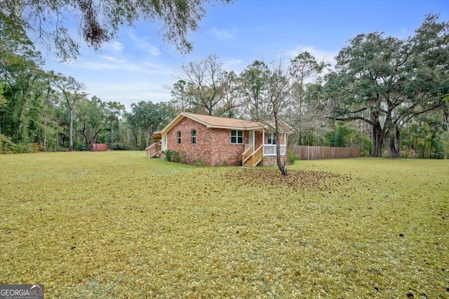 exterior space featuring a front yard