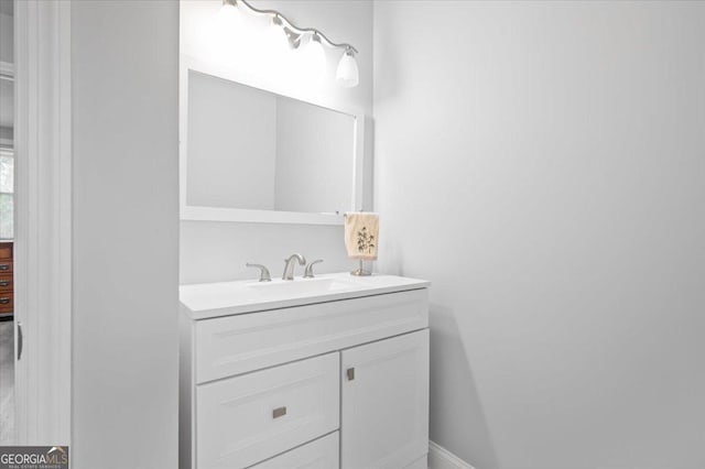 bathroom with vanity and baseboards