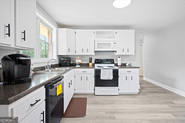 kitchen featuring black dishwasher, electric range, dark countertops, white microwave, and white cabinetry