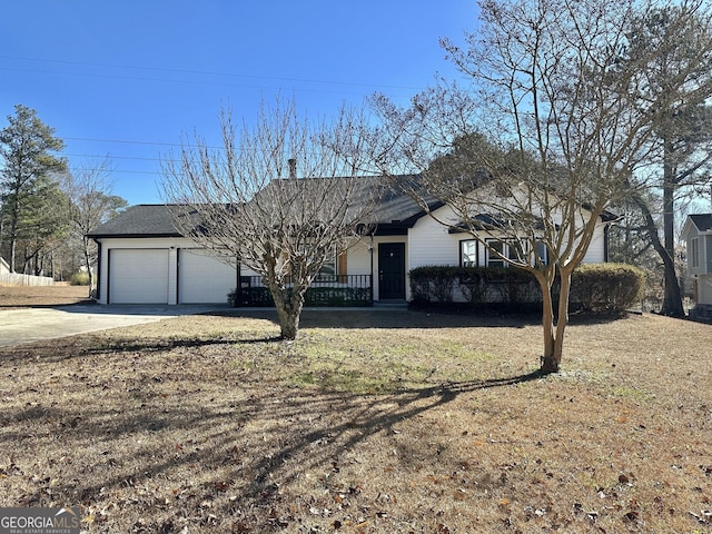 ranch-style house with a garage and a front yard